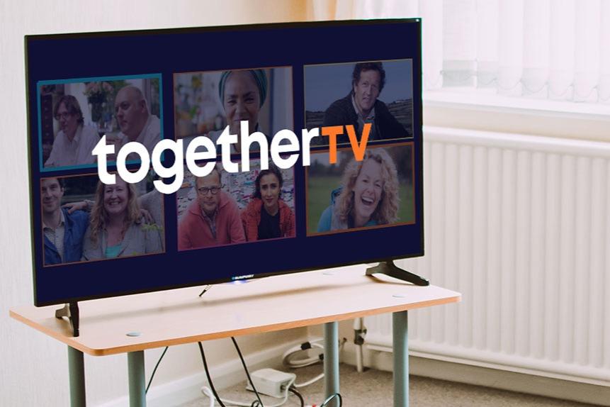 A television with together tv logo
