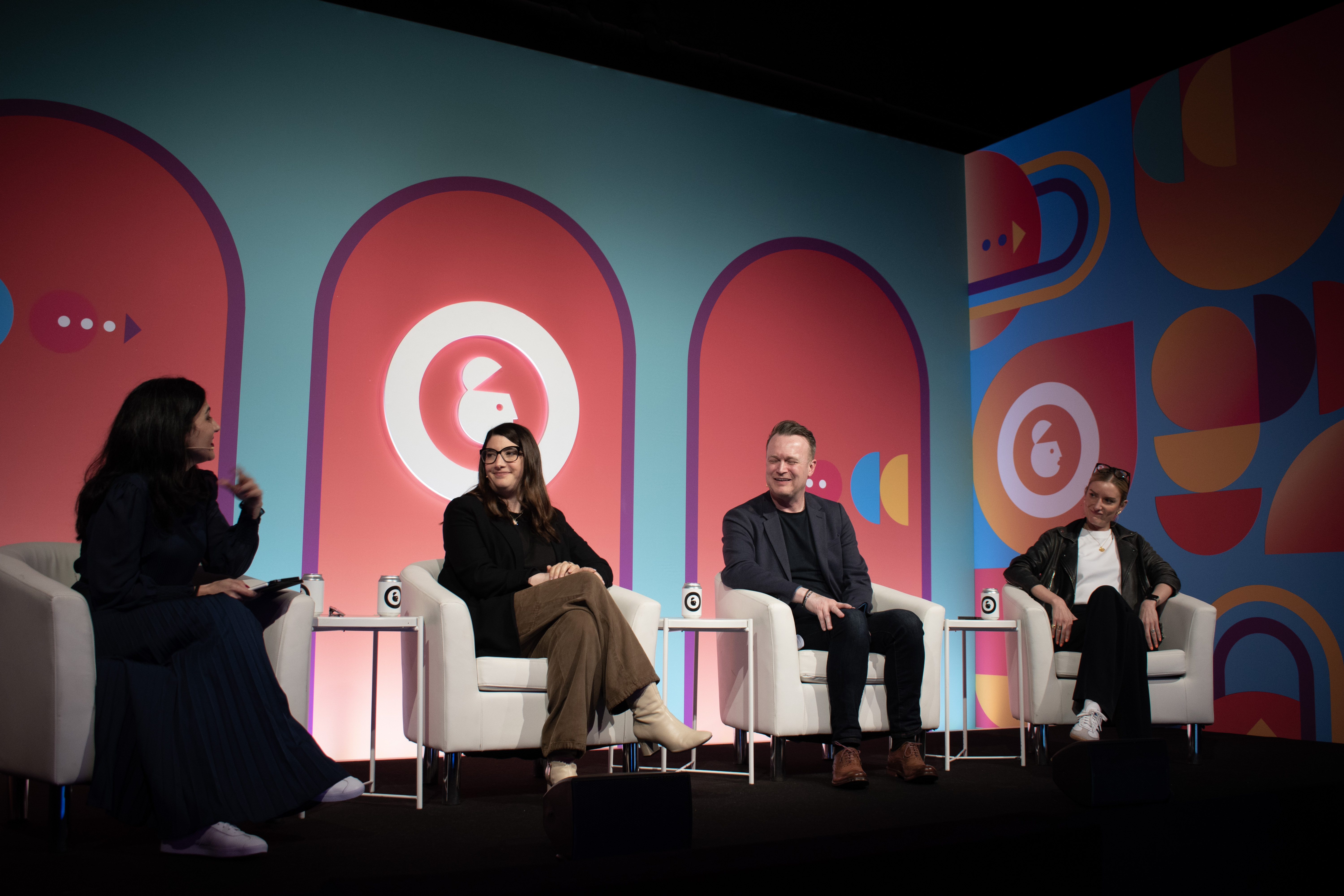 The 3 panellists (Jane, Paul and Katie) are looking towards Franesca who is sat on the left. Behind them is the Advertising week Europe branding.