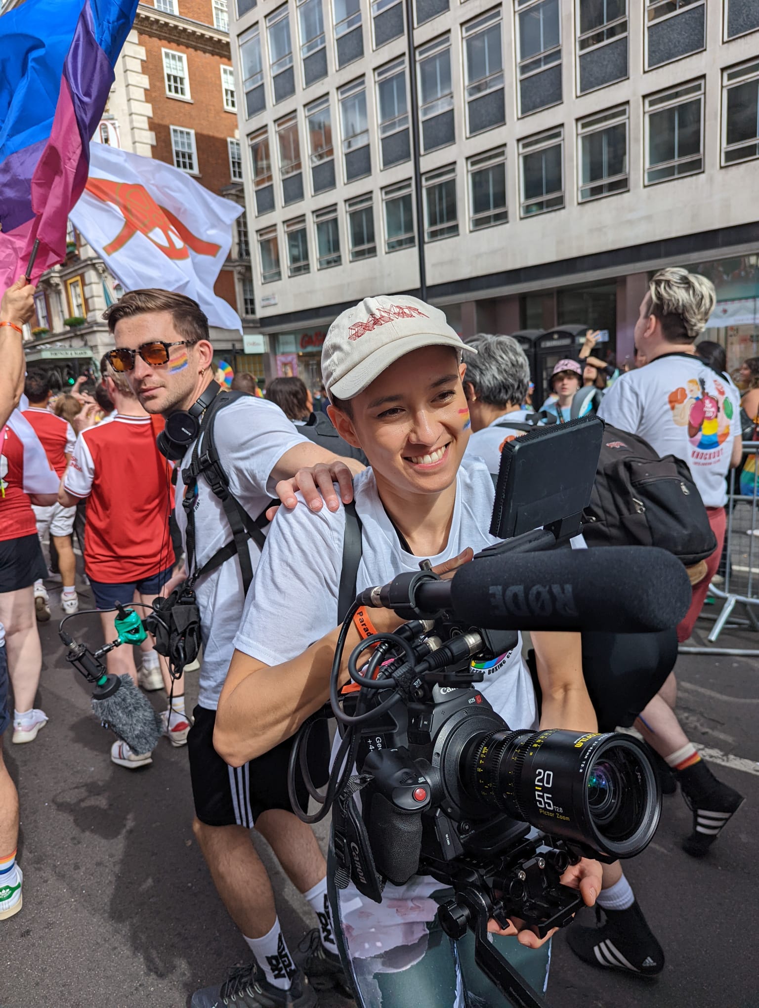 The crew, specifically Tom and his cameraperrson, film at Pride.