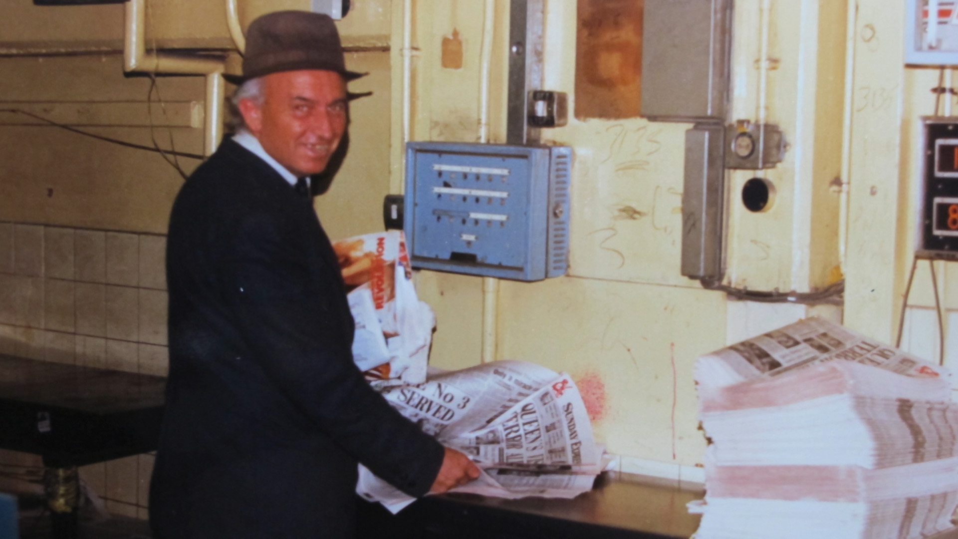 newspaper employee with newspaper. Old photograph.