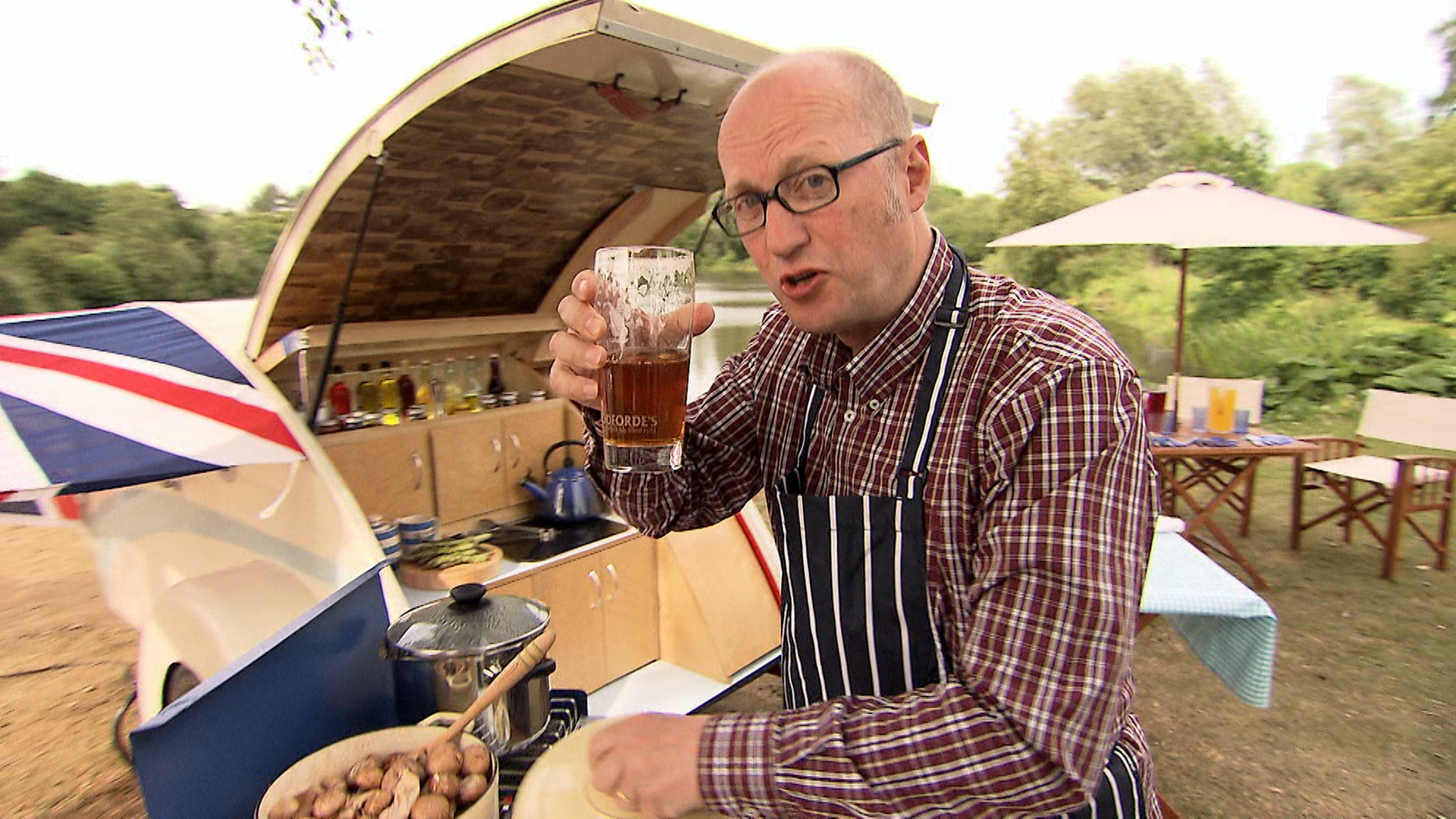 Drink a beer with Ade as he grills some food. 