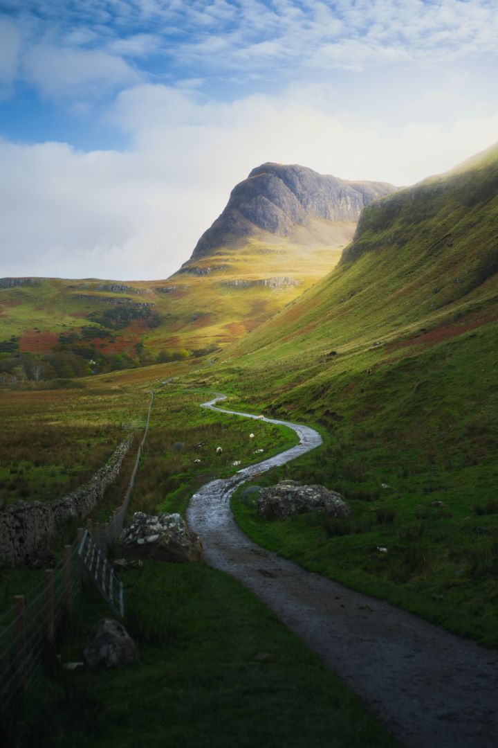 Photo of the walking path to reach Talisker Bay. The knuckly hill is Preshal More. Photo credit Photo by @iancylkowskiphotography via Unsplash